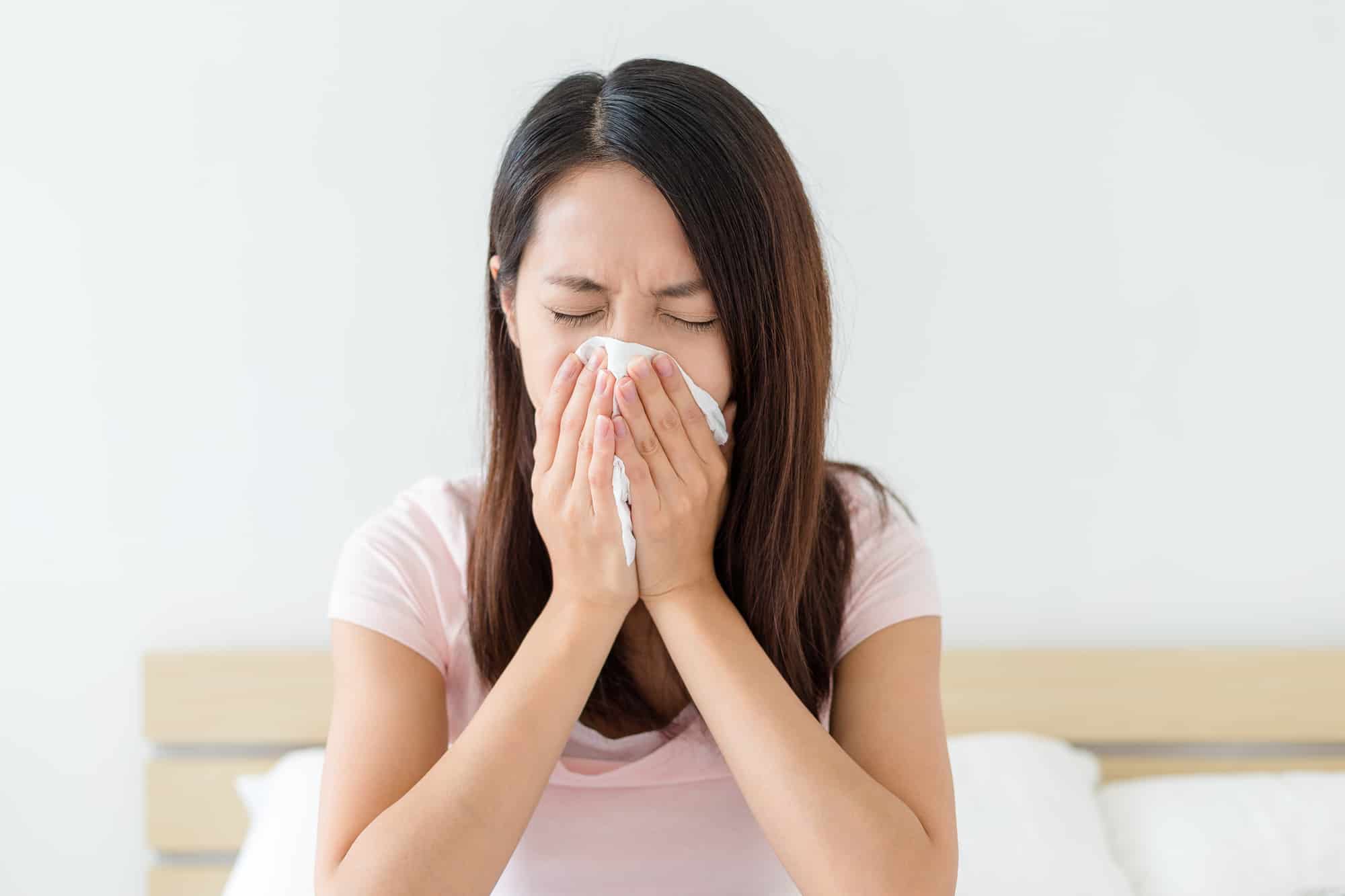 A woman who suffers from allergies is not feeling well