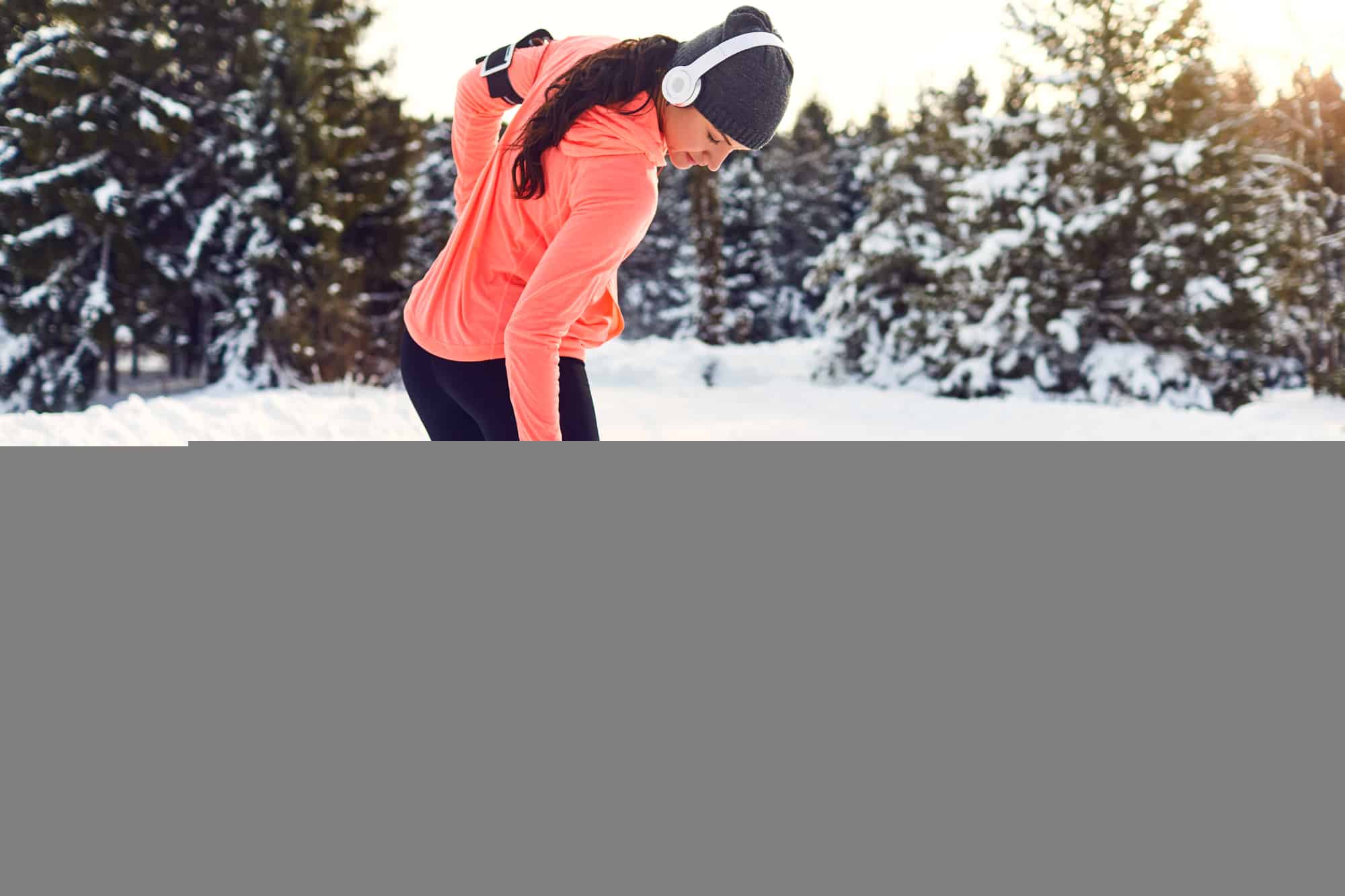 Stretching because of experiencing leg pain while running in winter.