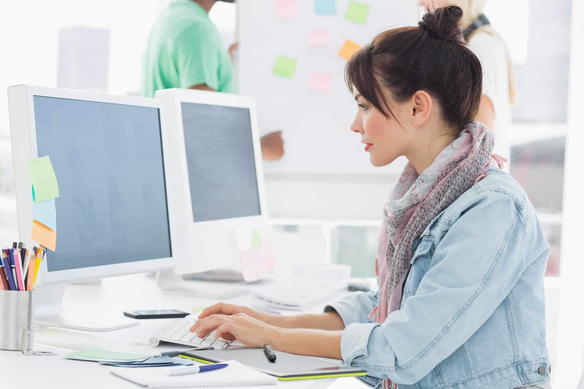 Woman working in front at the computer