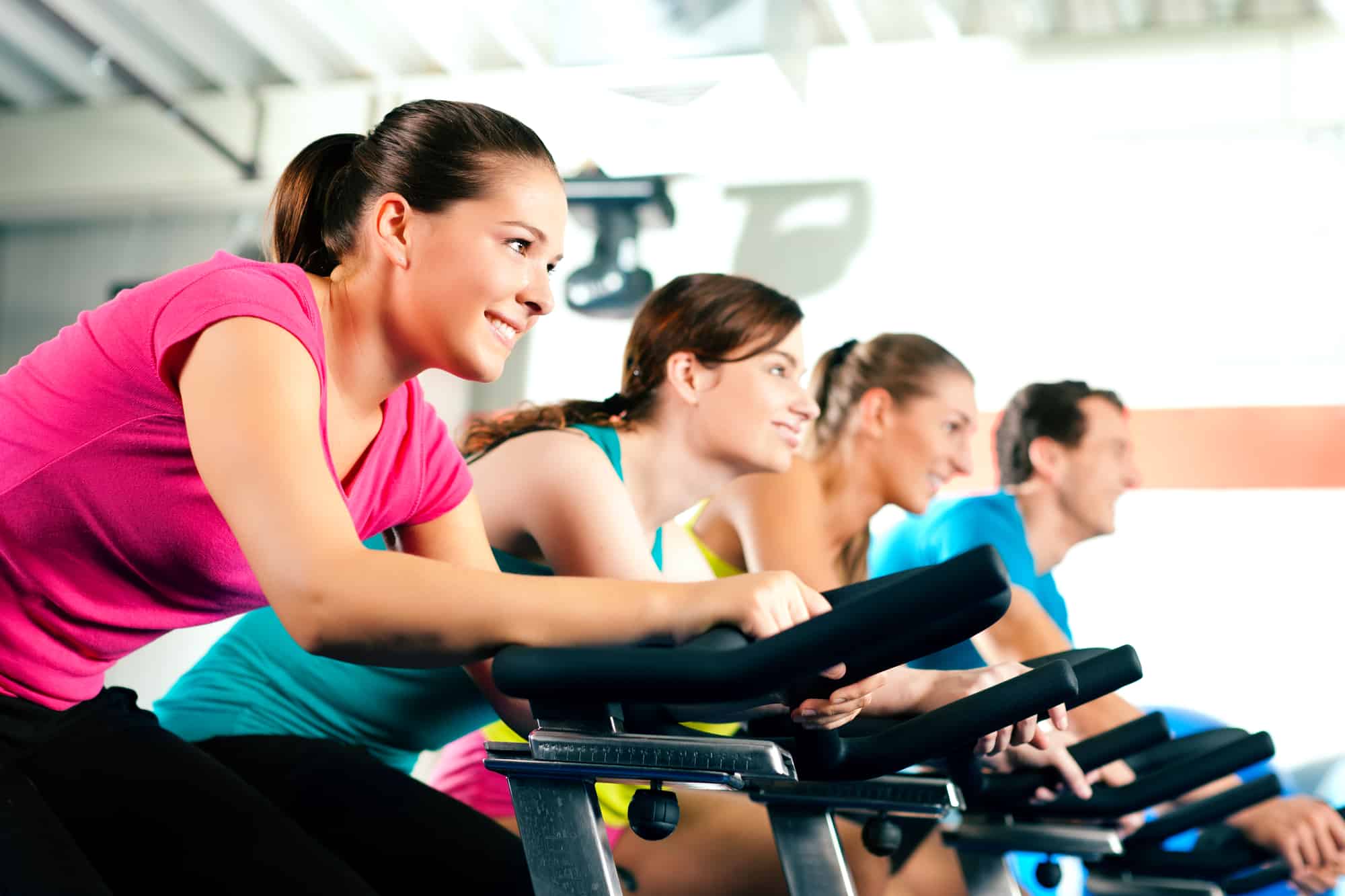 A group of four people engaging in their exercise routine