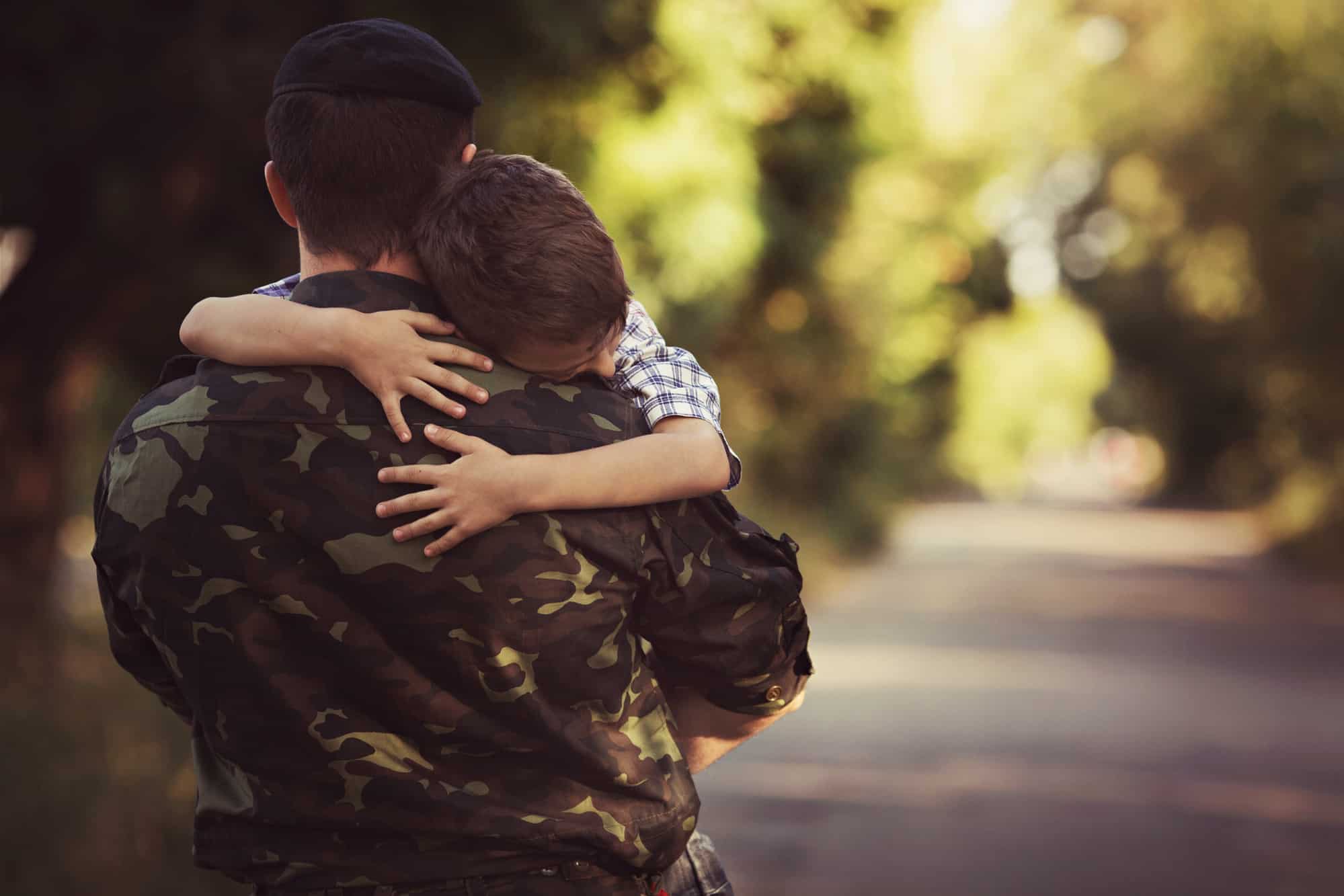 A military personnel hugged his son