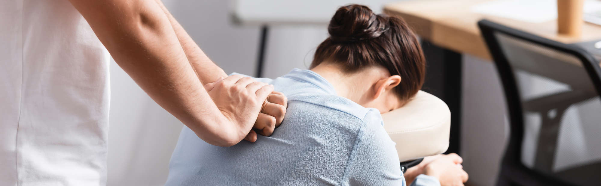 A woman receiving regular chiropractic adjustments