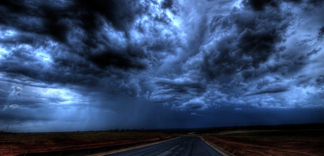 An image of the sky with huge, dark clouds