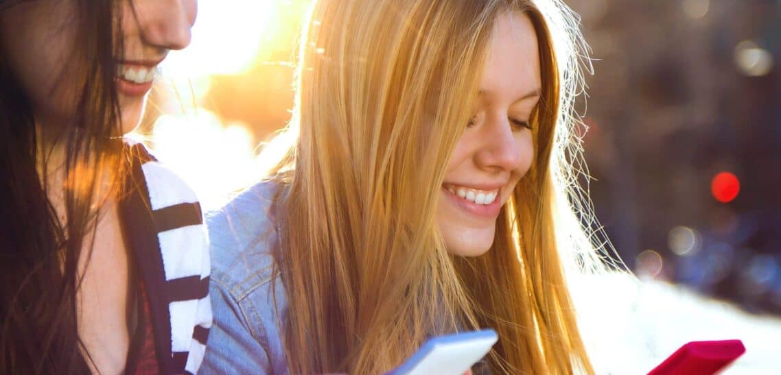 A Woman using her smartphone Texting Posture Amounts to Carrying Bowling Balls on the Neck