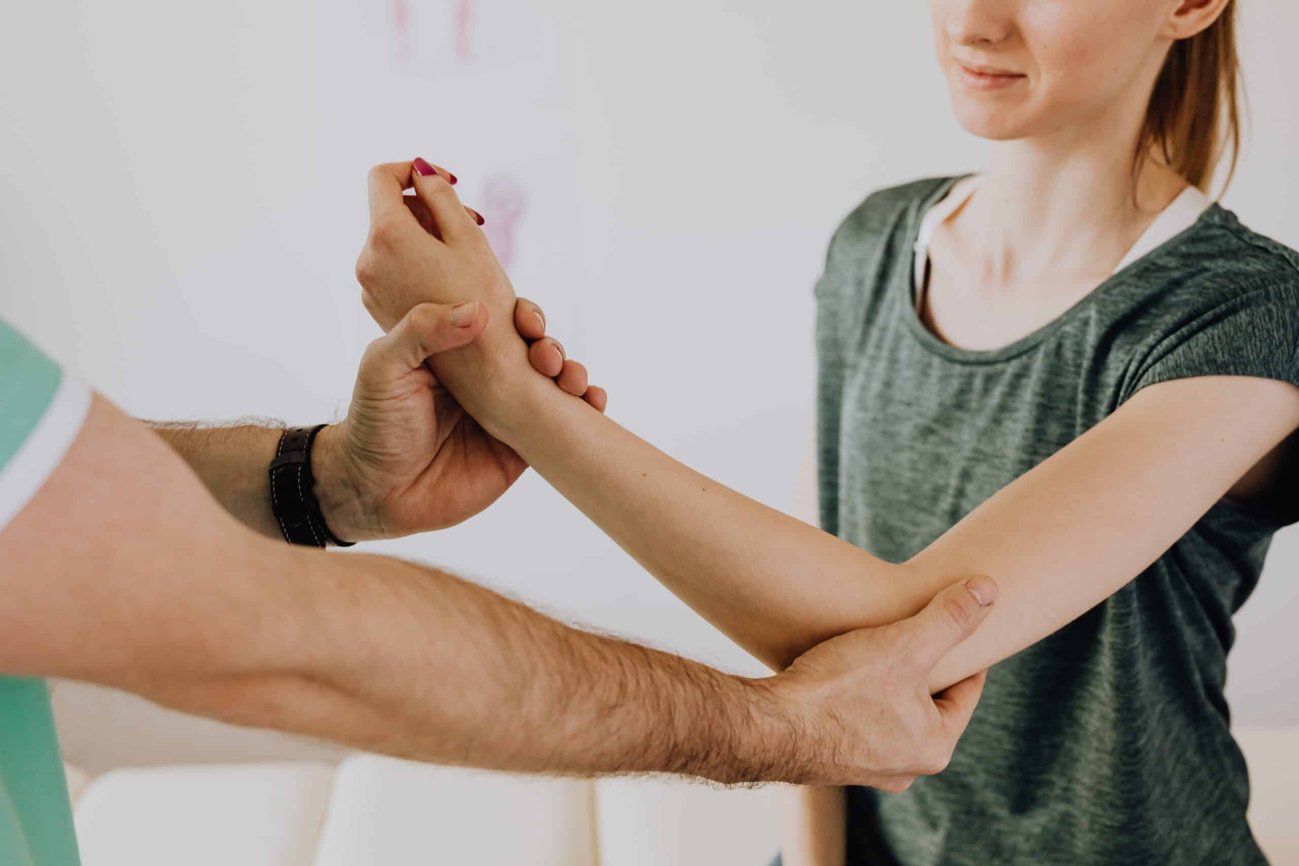 A girl is having a chiropractic session to address her joint pain