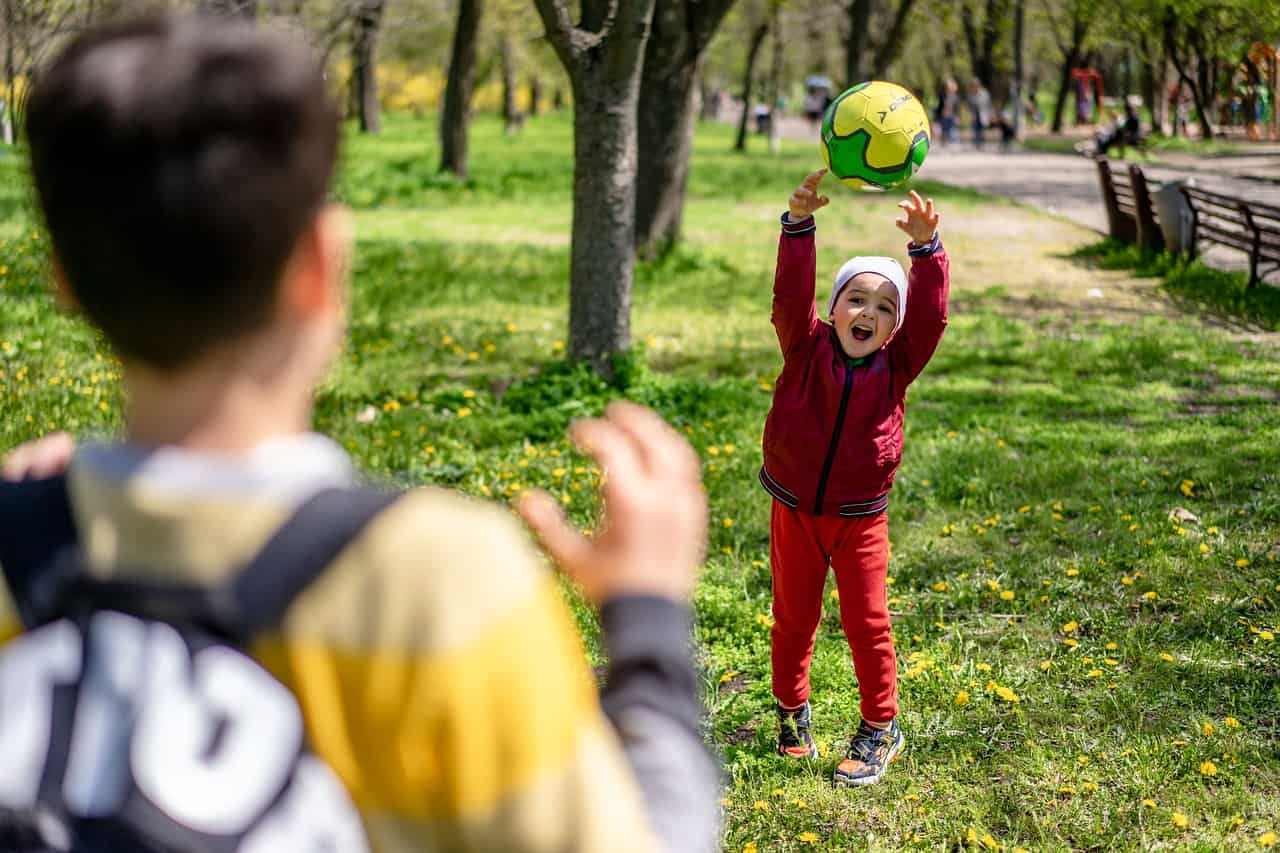 a young boy playing with his friend