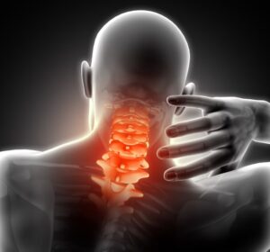 A man is experiencing severe pain at the back of his neck