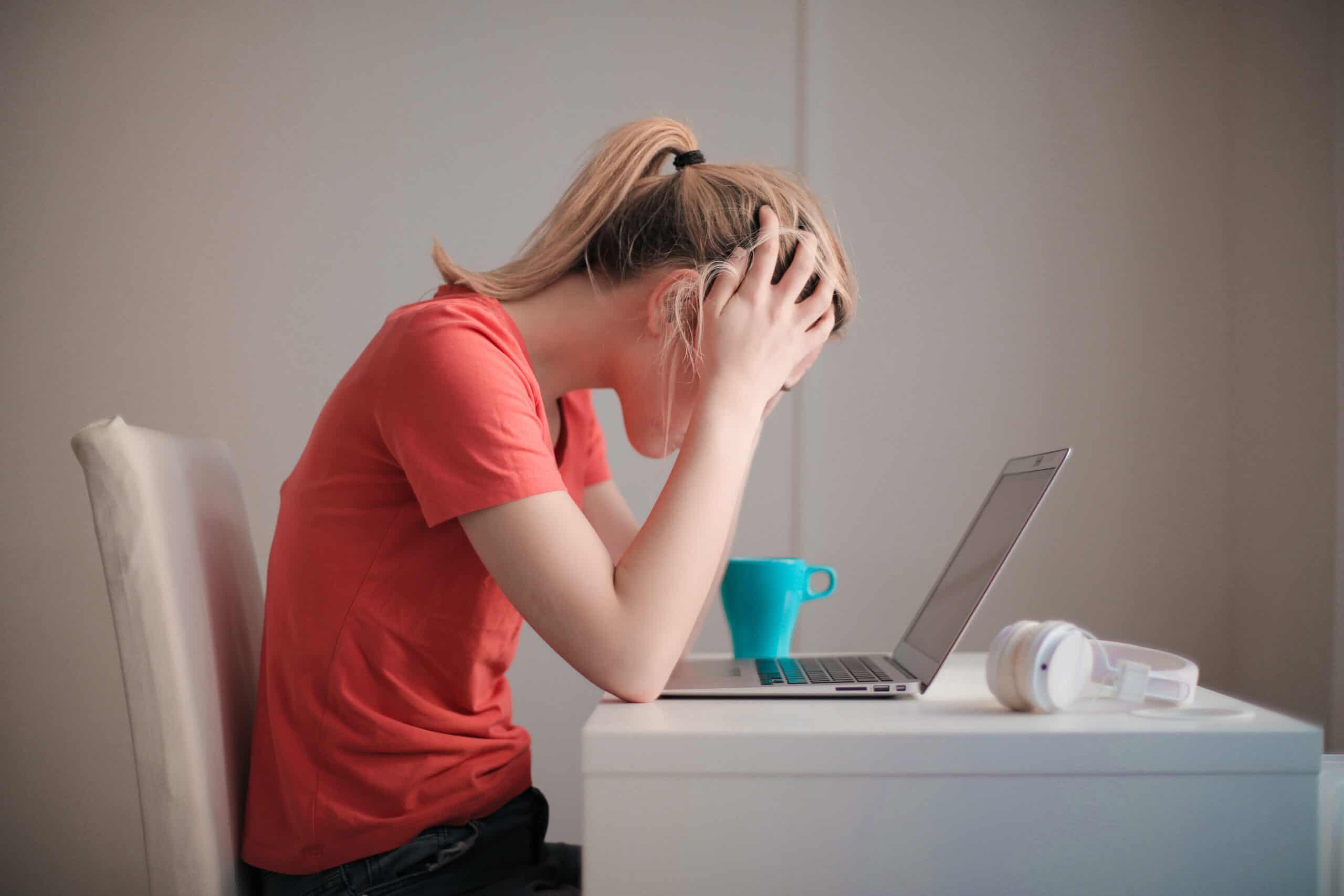 A girl experiencing anxiety while working