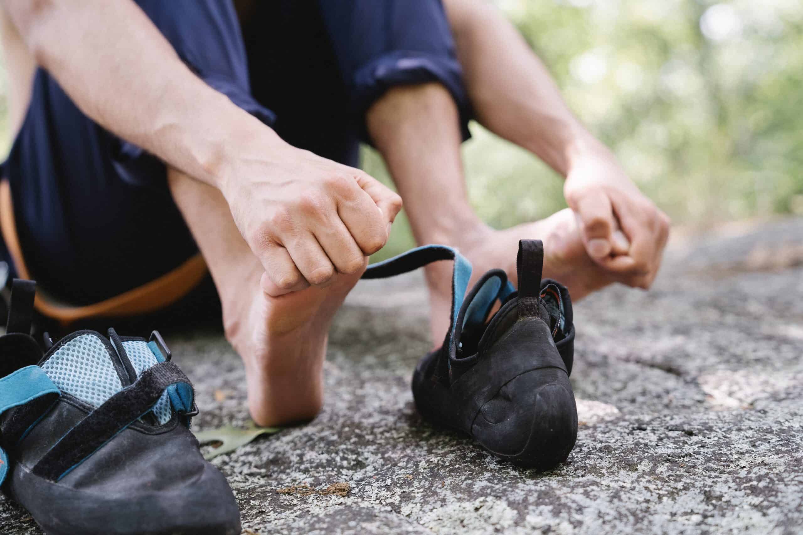 A man is experiencing severe pain in his feet