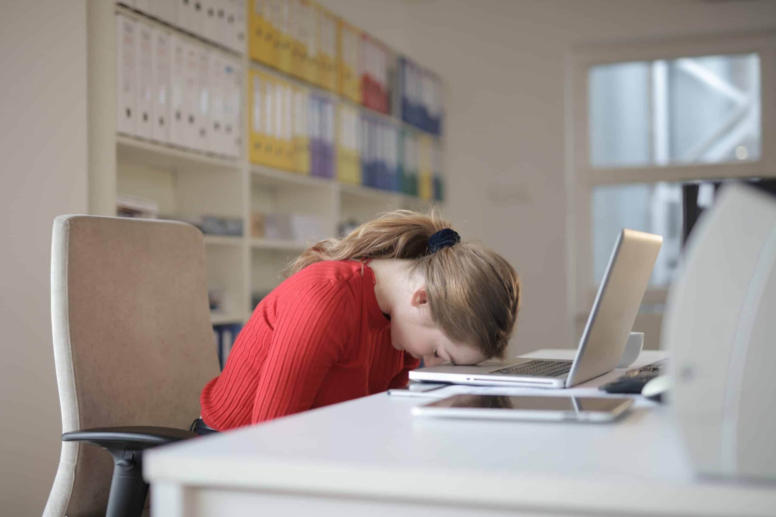 A woman worked long hours in the office and experienced back pain.