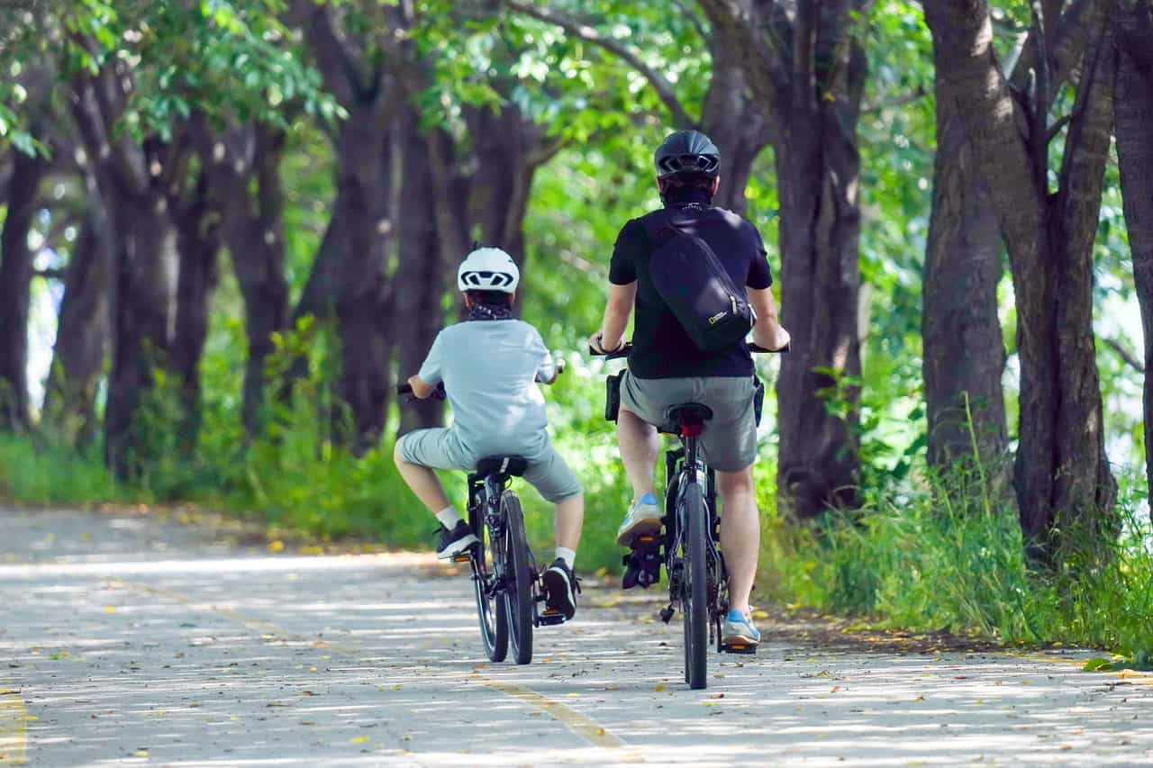 riding a bicycle with his son - Eastern Oklahoma Chiropractic riding a bicycle with his son